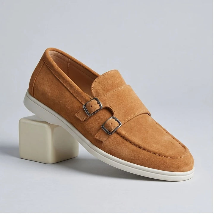 Tan suede double monk strap loafers with white soles.