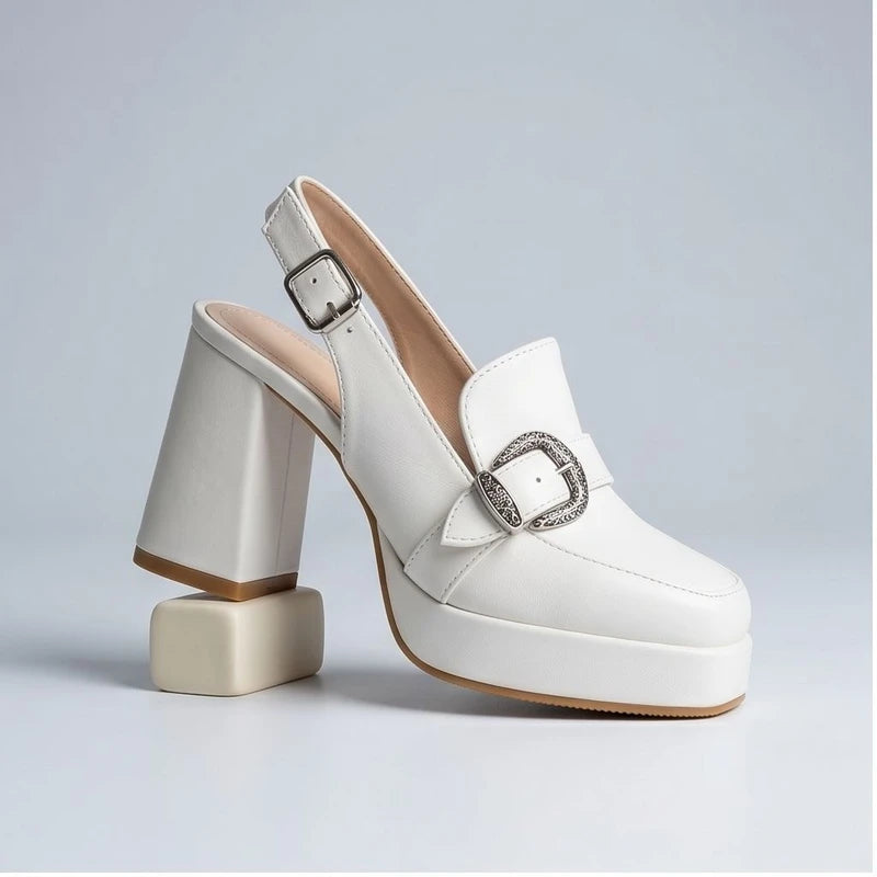 White leather Belinda platform slingback heels with ornate buckle.