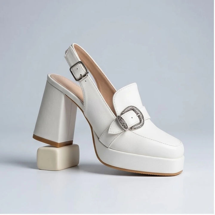 White leather Belinda platform slingback heels with ornate buckle.