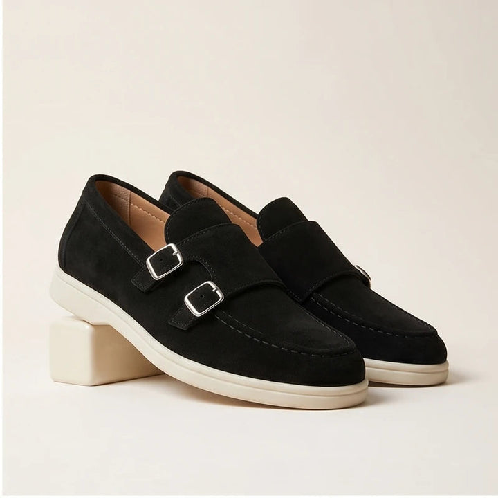 Black suede double monk strap loafers with white soles.