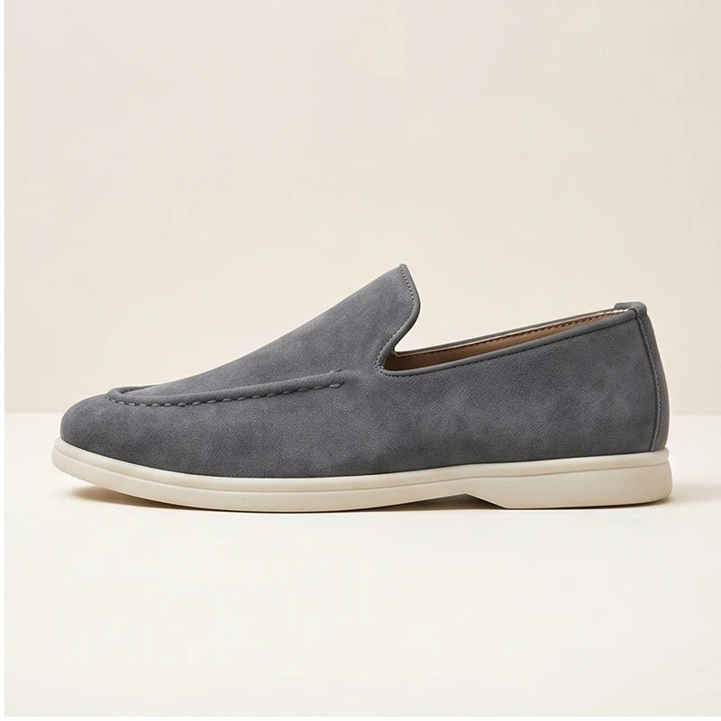 Gray suede loafers in a studio background - 2