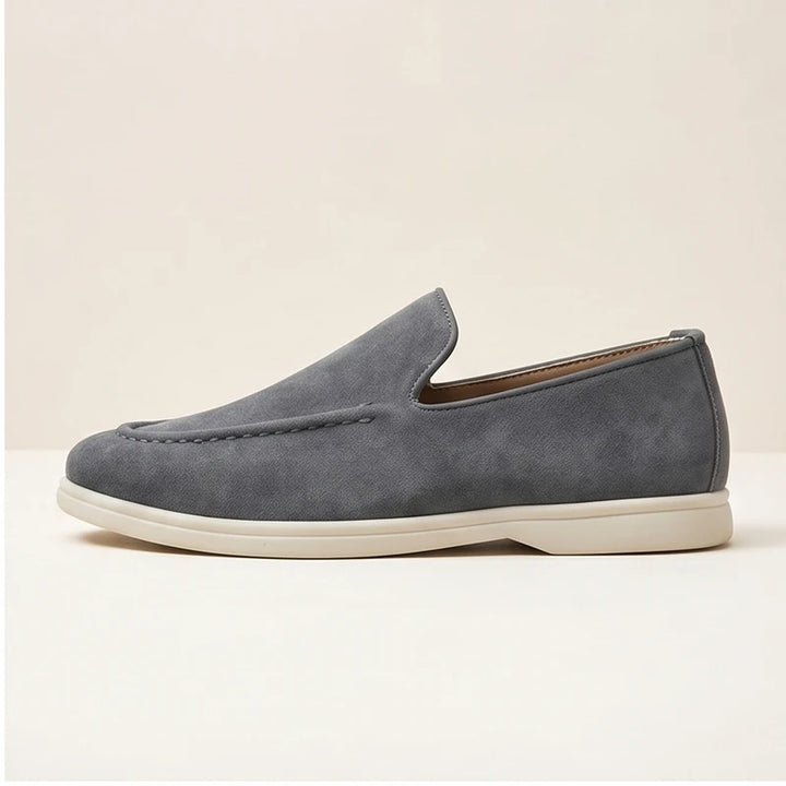 Gray suede loafers in a studio background - 2