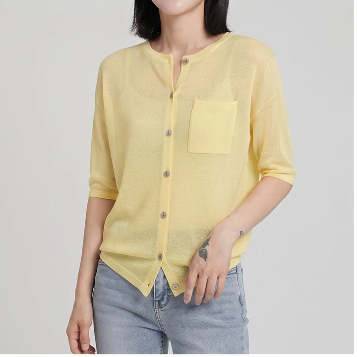 Model wearing Yellow cardigan in a studio