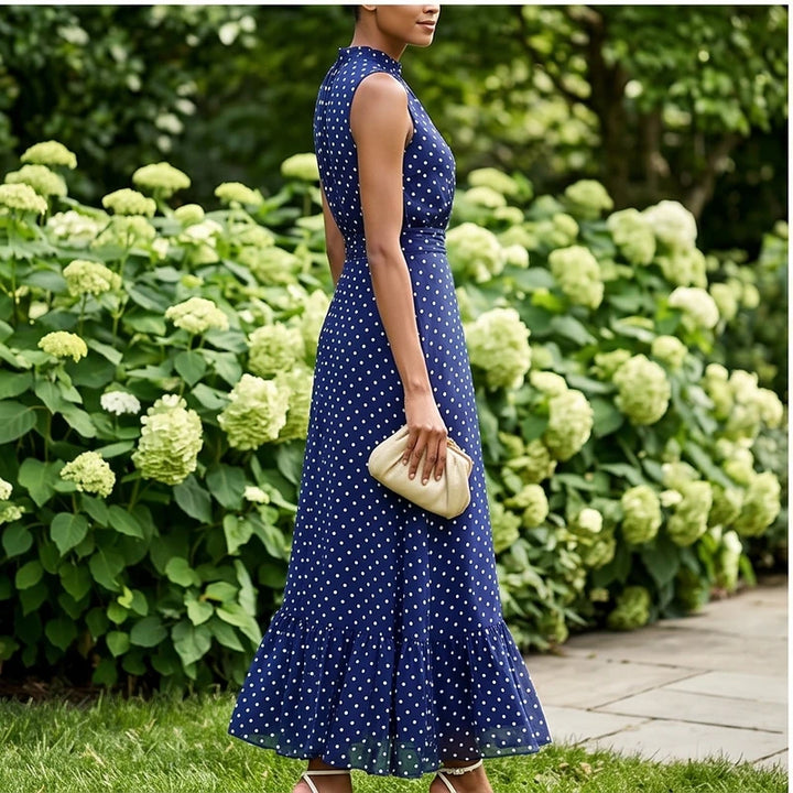 Model wearing Blue Sleeveless Polka Dot Chiffon Maxi Dress with Ruffle Hem and Flowing A Line Silhouette for Summer Parties outdoors - 3