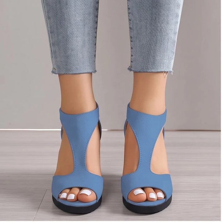 Model wearing Blue sandals in a studio