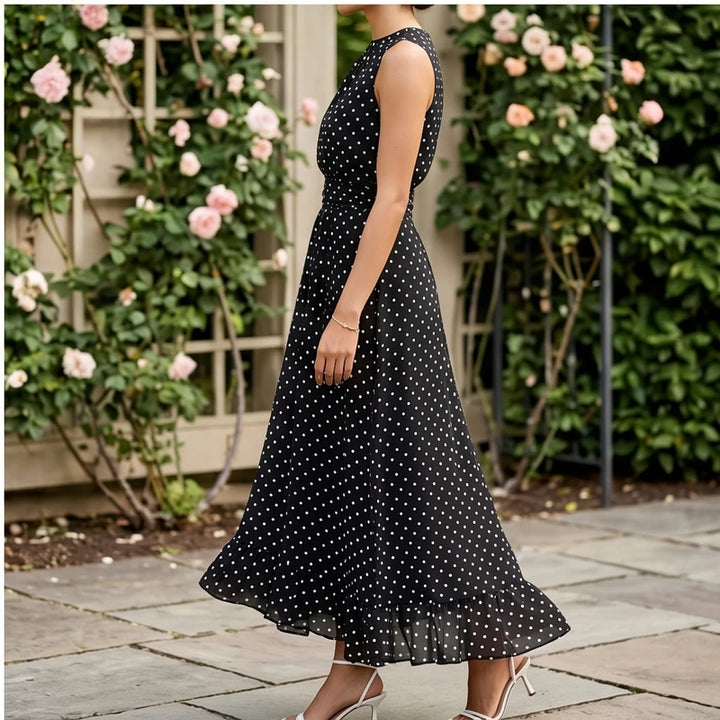 Model wearing Black Sleeveless Polka Dot Chiffon Maxi Dress with Ruffle Hem and Flowing A Line Silhouette for Summer Parties outdoors - 4