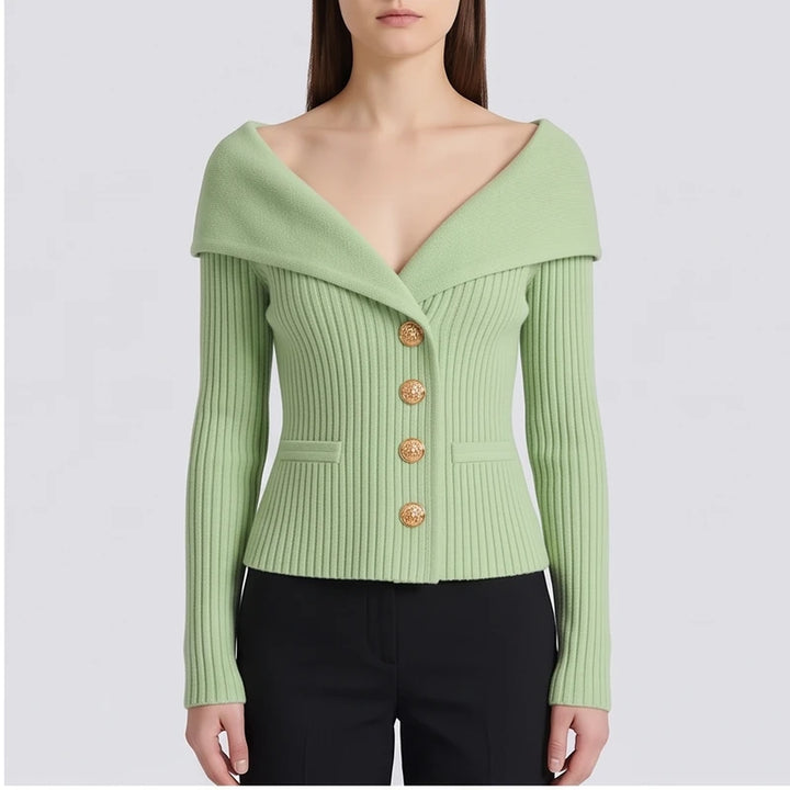 Model wearing green knitted jacket in a studio