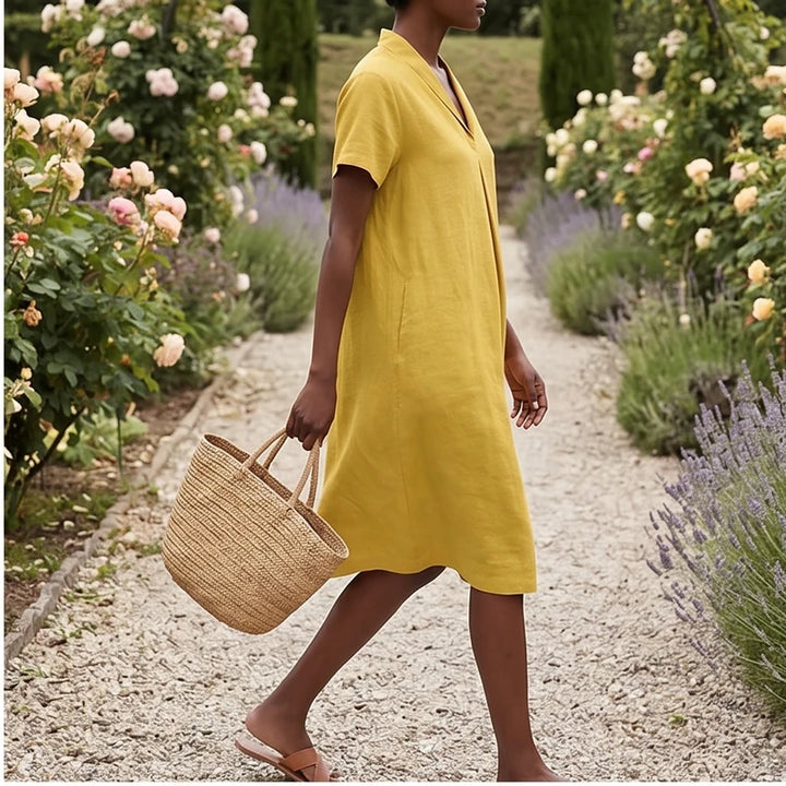 Model wearing Yellow Women's Short-sleeved Cotton and Linen Dress V-neck Loose Large Size Casual Vacation Street Long Dress with Pockets outdoors - 2