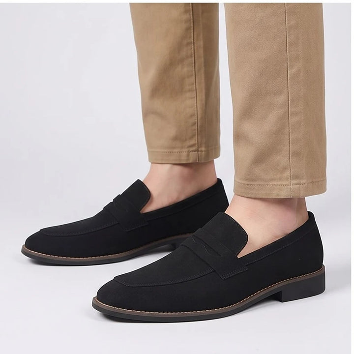 Model wearing Black suede loafers in a studio - 3