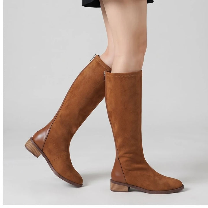 Model wearing Camel shoes in a studio