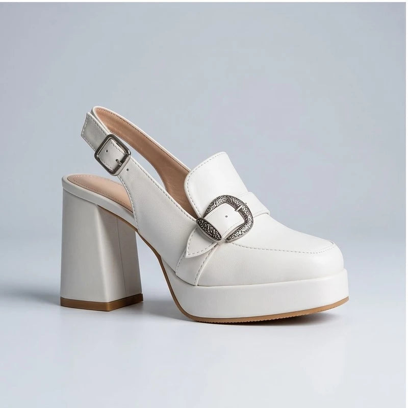 White leather platform slingback heels with a decorative buckle.