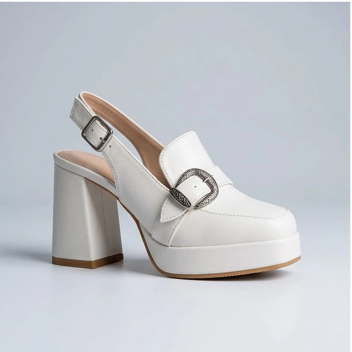 White leather platform slingback heels with a decorative buckle.