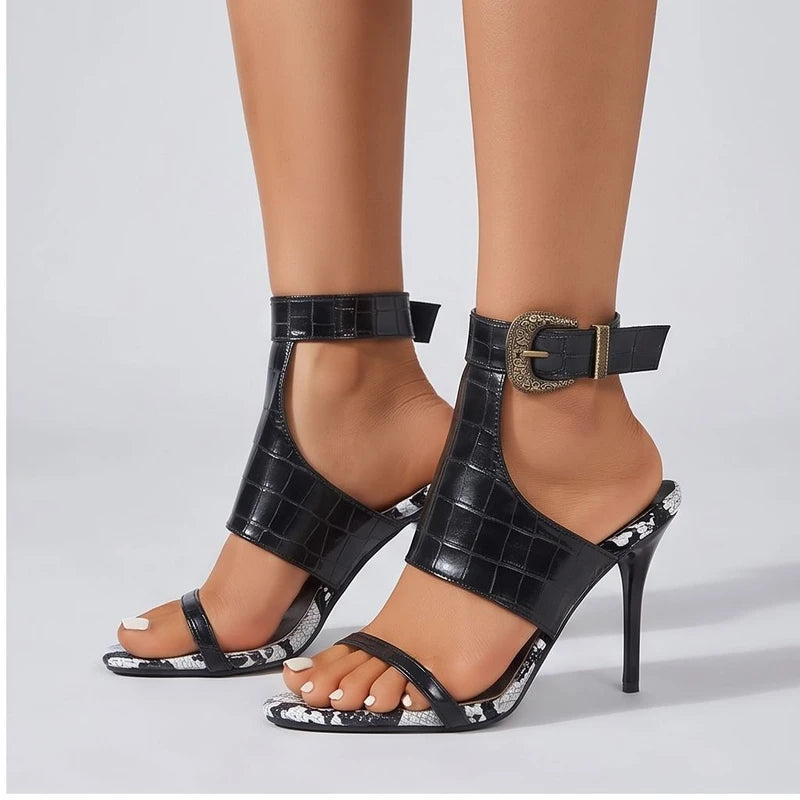 Model wearing Black heel in a studio