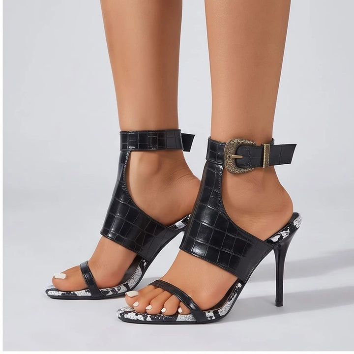 Model wearing Black heel in a studio