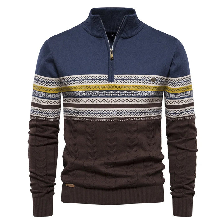 Blue and brown sweater with patterned sleeves on a white background