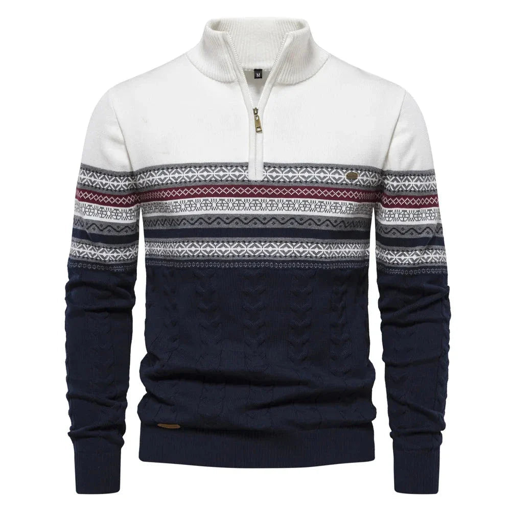 White and navy and white sweater with patterned sleeves on a white background