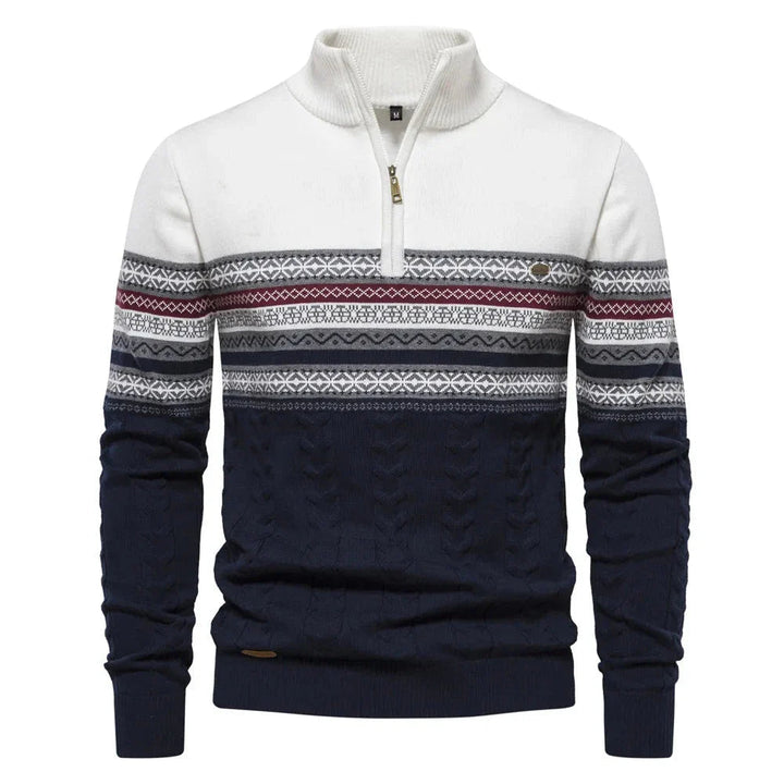 White and navy and white sweater with patterned sleeves on a white background