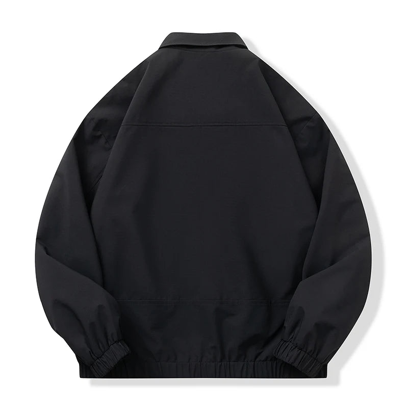 A black lightweight jacket with elasticized cuffs and hem, shown from the back on a clean white background.
