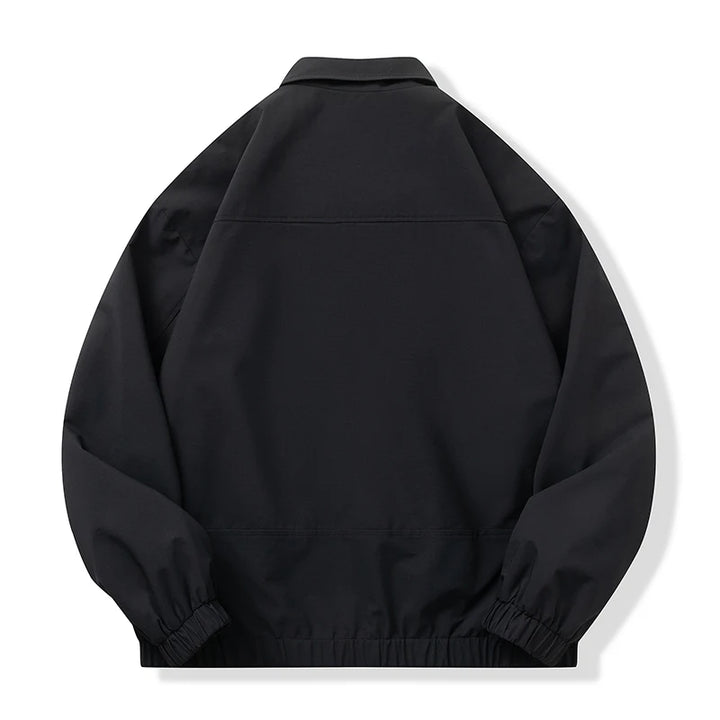 A black lightweight jacket with elasticized cuffs and hem, shown from the back on a clean white background.