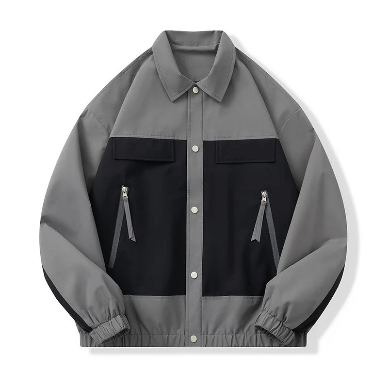Gray and black jacket with zipper details on a white background