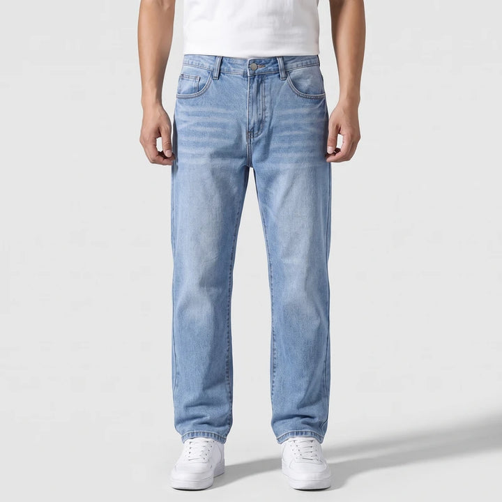 Lichtblauw jeans on an off-gray studio background