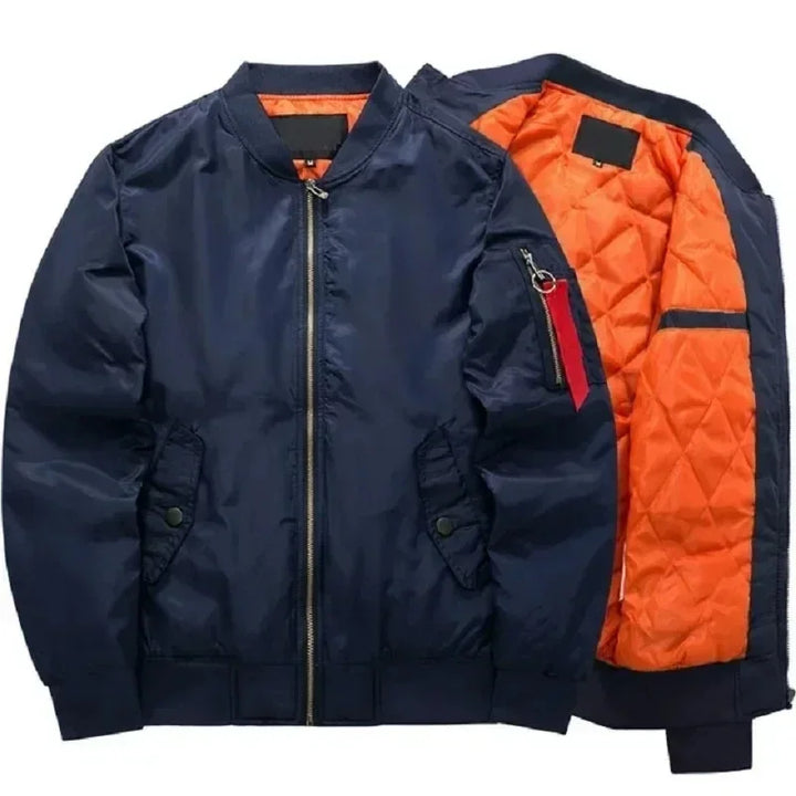 Dark blue bomber jacket with a gold zipper, ribbed collar, and bright orange quilted lining partially visible.