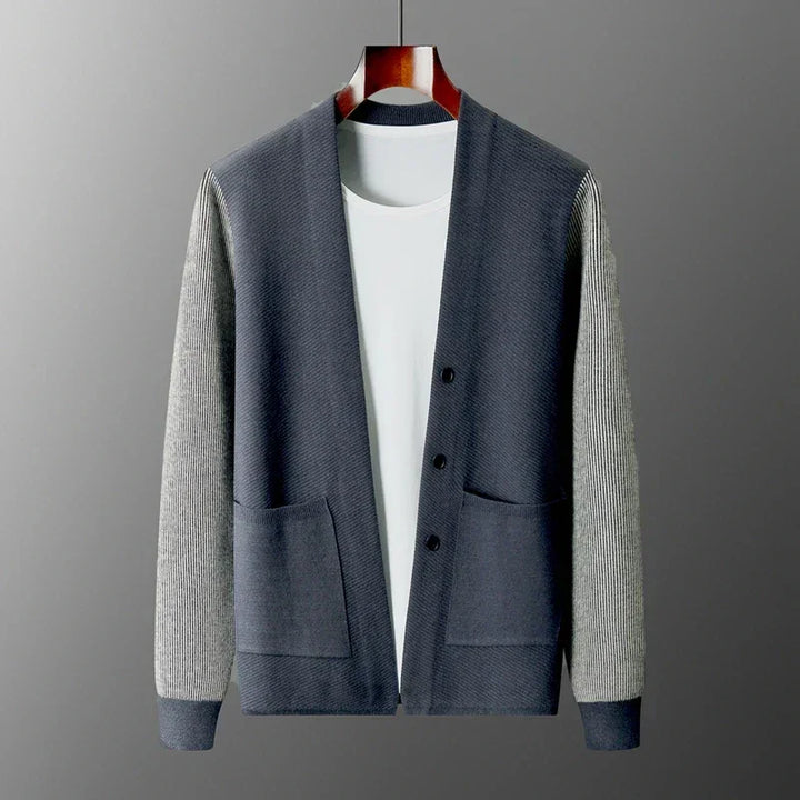 Rowan Merino Cardigan in navy and gray, featuring ribbed sleeves and button front design, perfect for versatile layering.