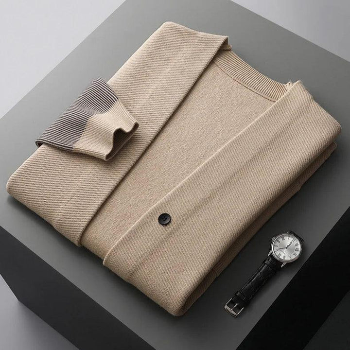 Rowan Merino Cardigan in beige, featuring ribbed contrast sleeves and clean button-front design.