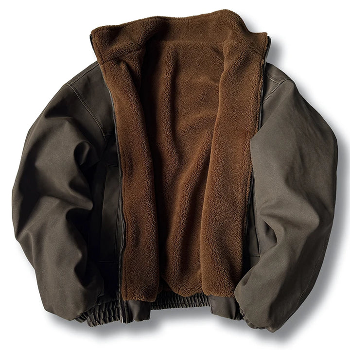 Open brown canvas jacket displayed flat, revealing a plush fleece lining, elastic hem, and front zipper against a white background.
