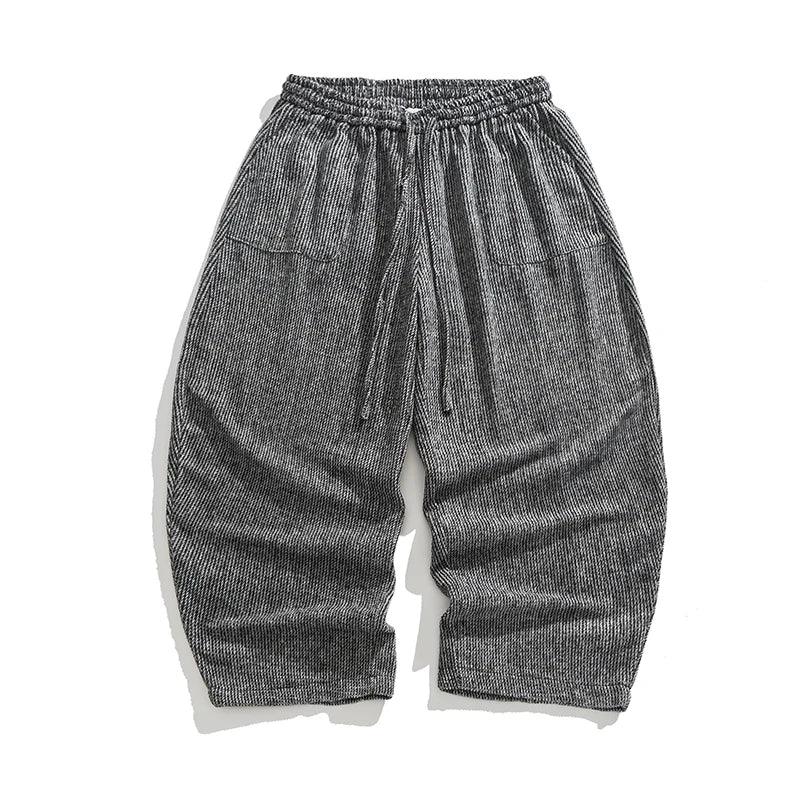 Henderson corduroy pants featuring a wide-leg fit, elastic waistband, deep pleats, and soft heavyweight corduroy texture.