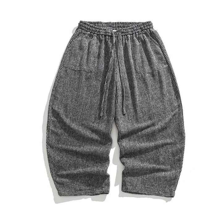 Henderson corduroy pants featuring a wide-leg fit, elastic waistband, deep pleats, and soft heavyweight corduroy texture.