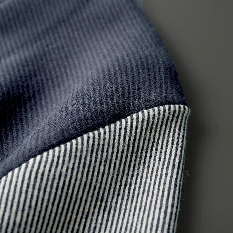 Close-up of ribbed contrast sleeve fabric on Rowan Merino Cardigan, showcasing soft merino wool textures.