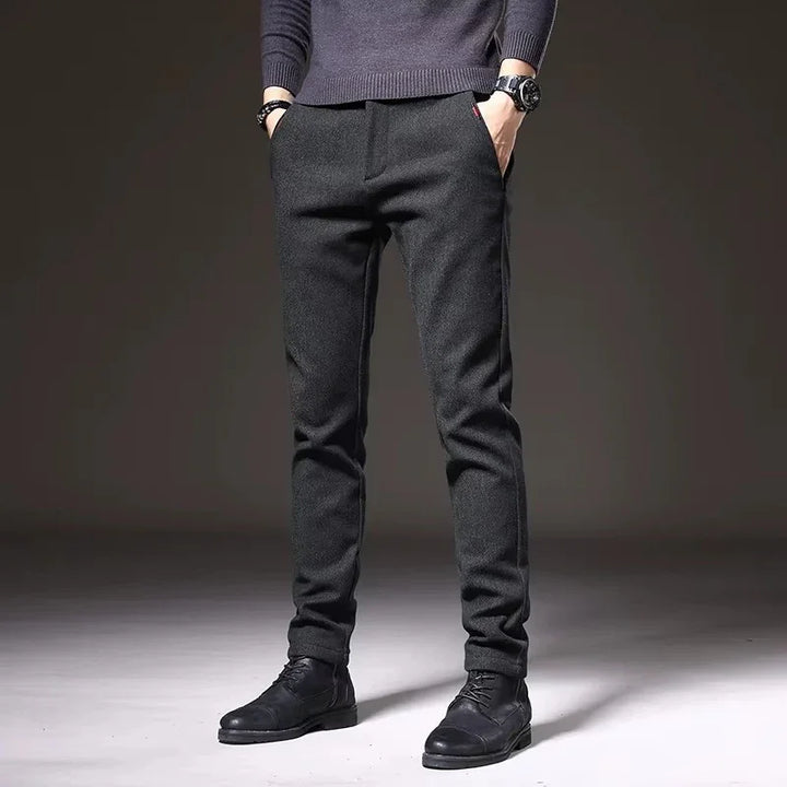 Henderson Slim-Fit Pants in dark color, showcasing a modern tailored design, perfect for casual and polished looks.