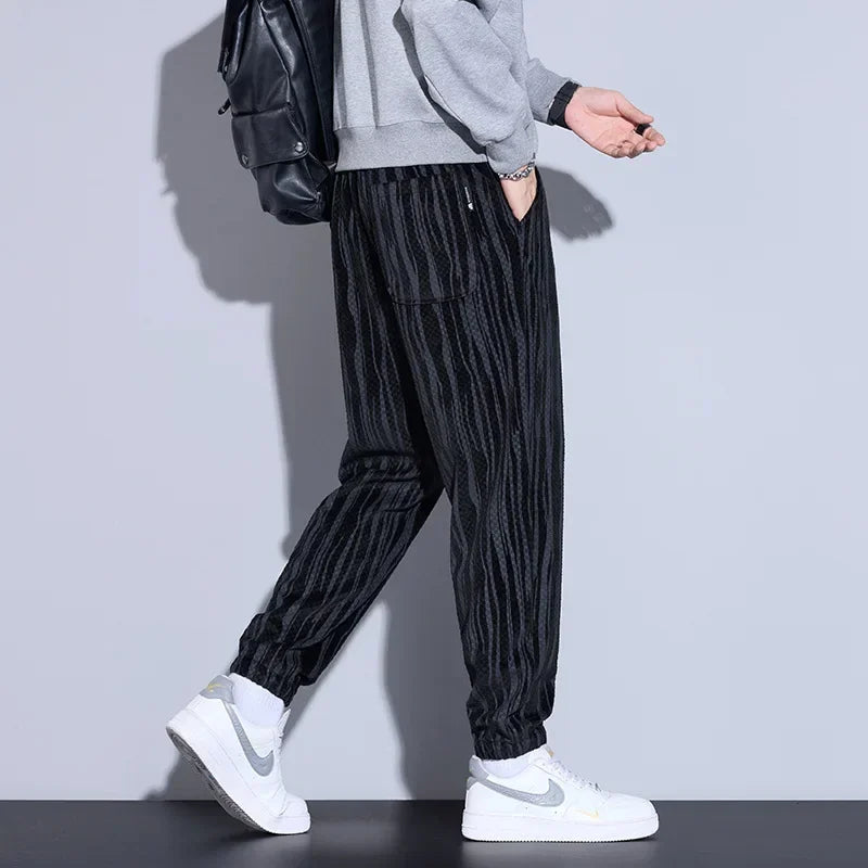 Model wearing Riden Checkered Corduroy Pants with a tapered fit, showcasing bold texture and comfort.