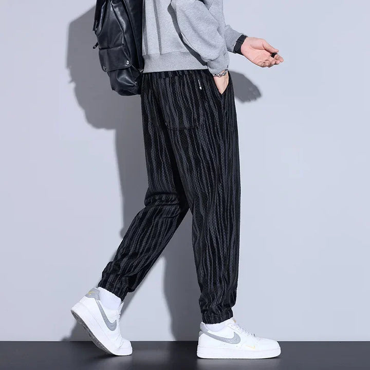 Model wearing Riden Checkered Corduroy Pants with a tapered fit, showcasing bold texture and comfort.