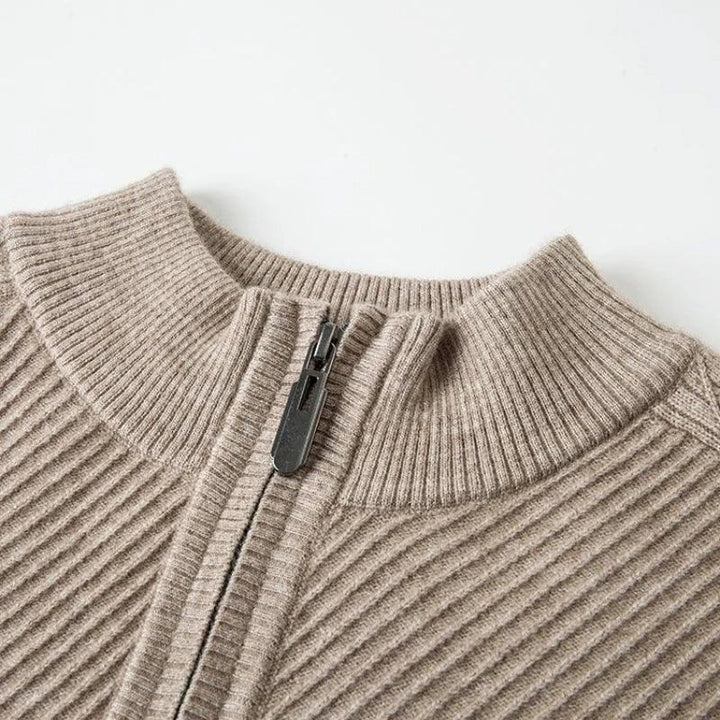Close-up of Windsor Quarter-Zip sweater showing textured knit and zipper design in a neutral beige color.