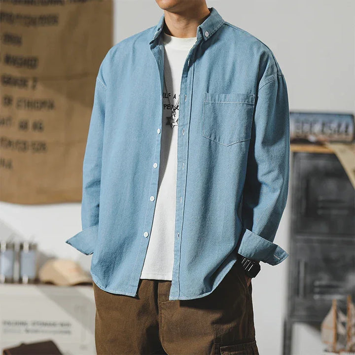 Frontier denim jacket in light blue, featuring a clean design and subtle distressing for everyday wear.
