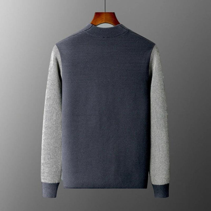 Back view of Rowan Merino Cardigan showcasing ribbed contrast sleeves and a clean silhouette.