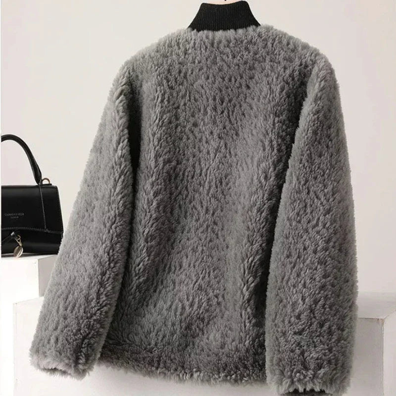 Gray fluffy cardigan on a mannequin against a white background