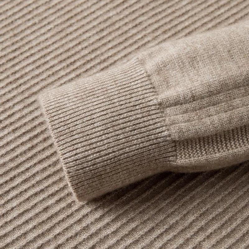 Close-up of the Windsor Quarter-Zip knitted sweater sleeve featuring premium fabric and textured pattern.