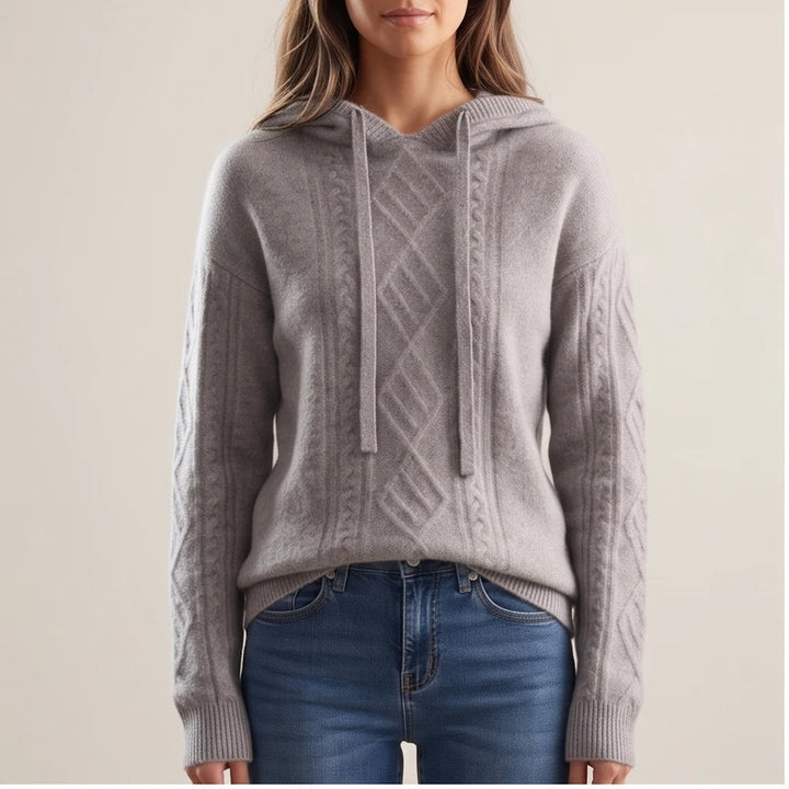 Woman wearing Gray knit sweater in a studio