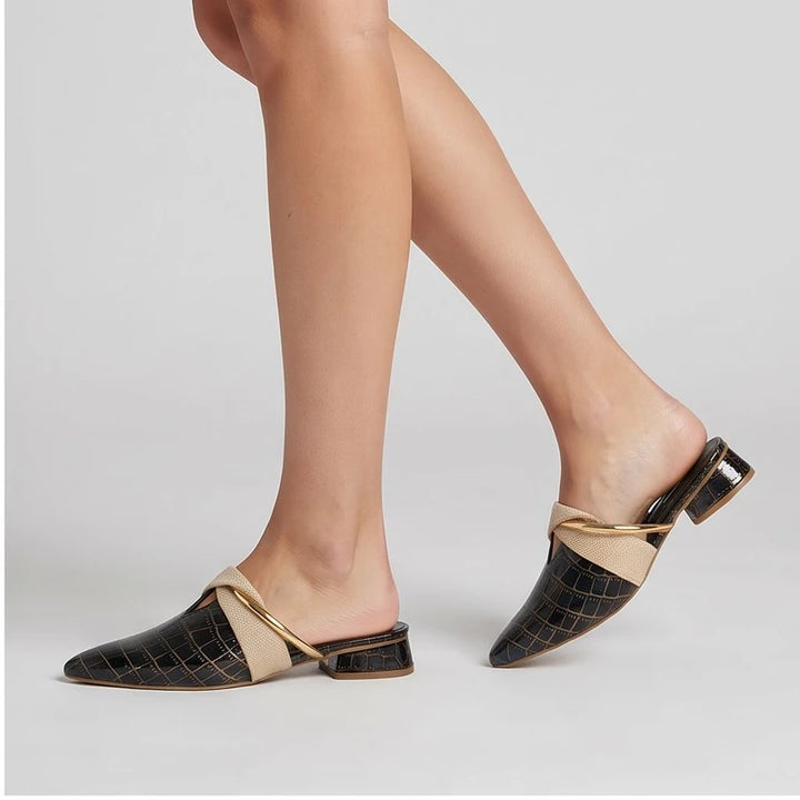 Model wearing Navy mule in a studio