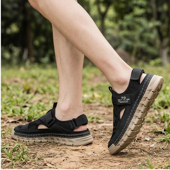 Model wearing Black Ridgeway Mesh Sport Sandals outdoors - 2