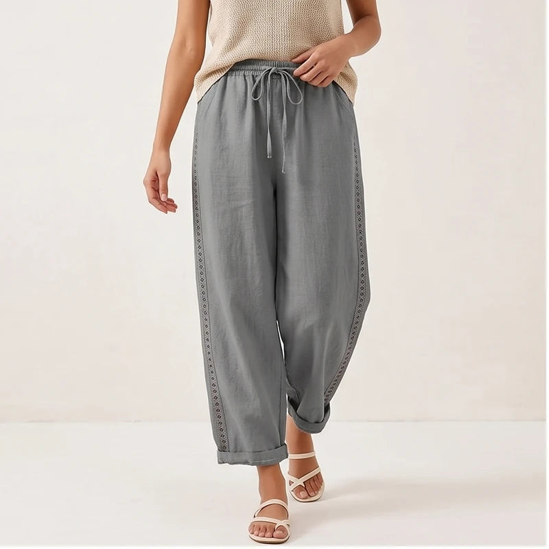 Model wearing Gray Lennox Straight-Leg Linen Drawstring Pants in studio