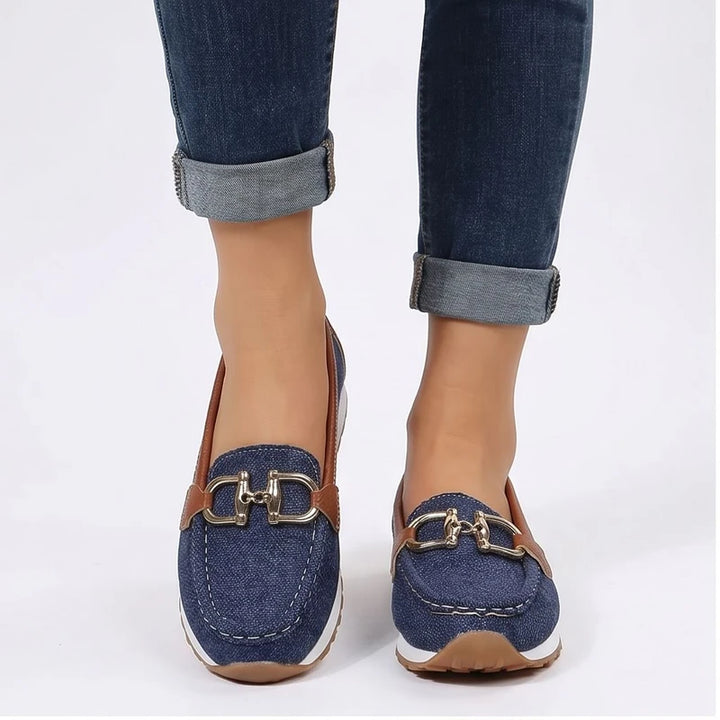 Model wearing Blue metal flat in a studio