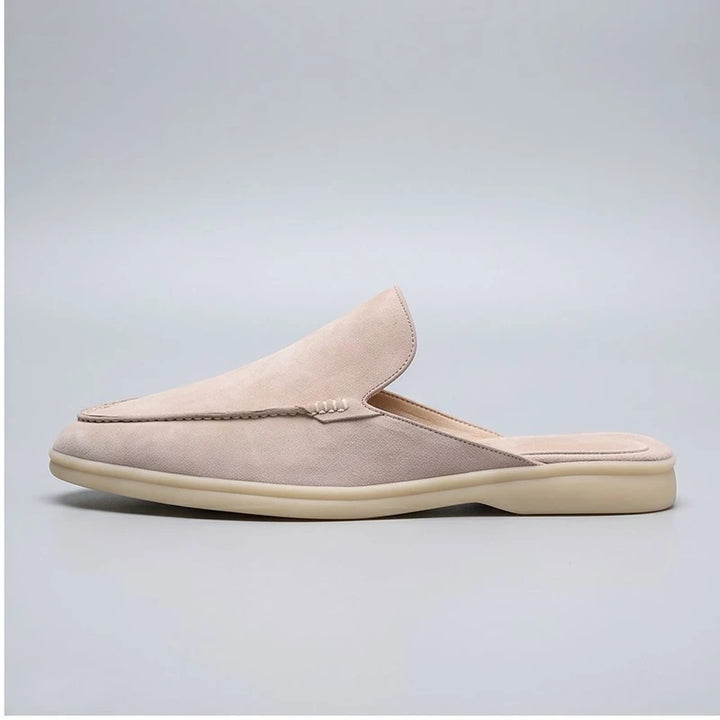 White suede mules in a studio background - 2