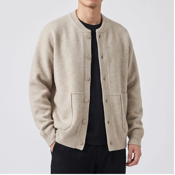Model wearing Ivory knitted cardigan in a studio