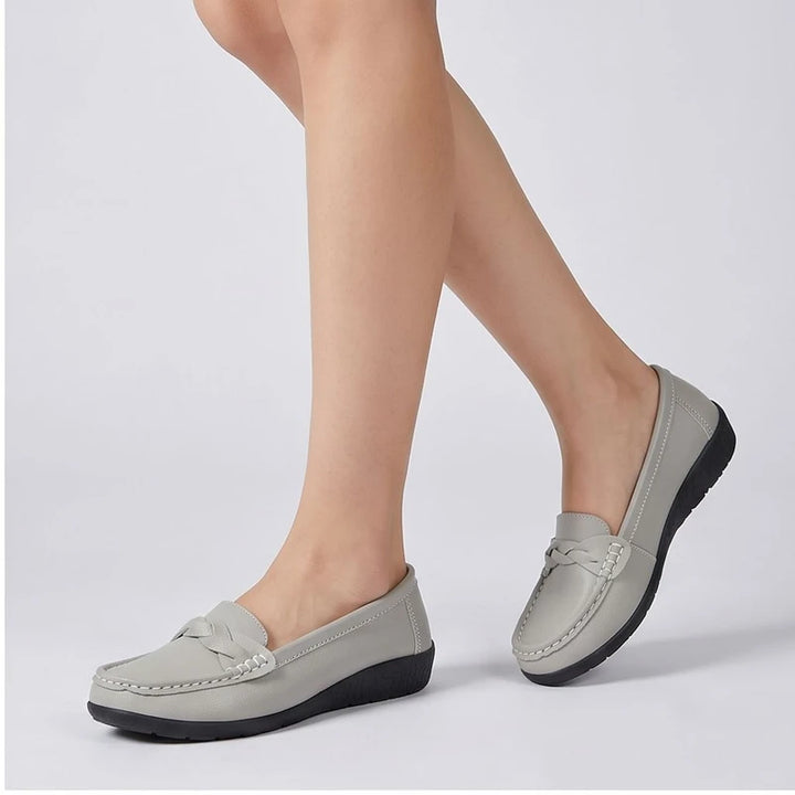 Model wearing Gray leather flats in a studio - 2