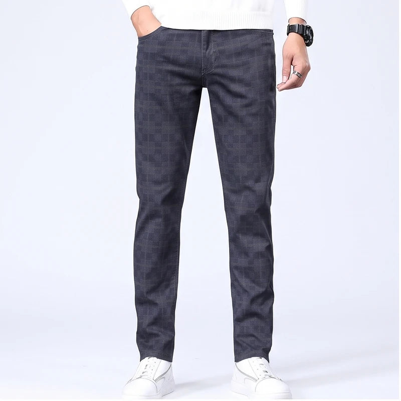 Model wearing grey blue cotton pants in a studio