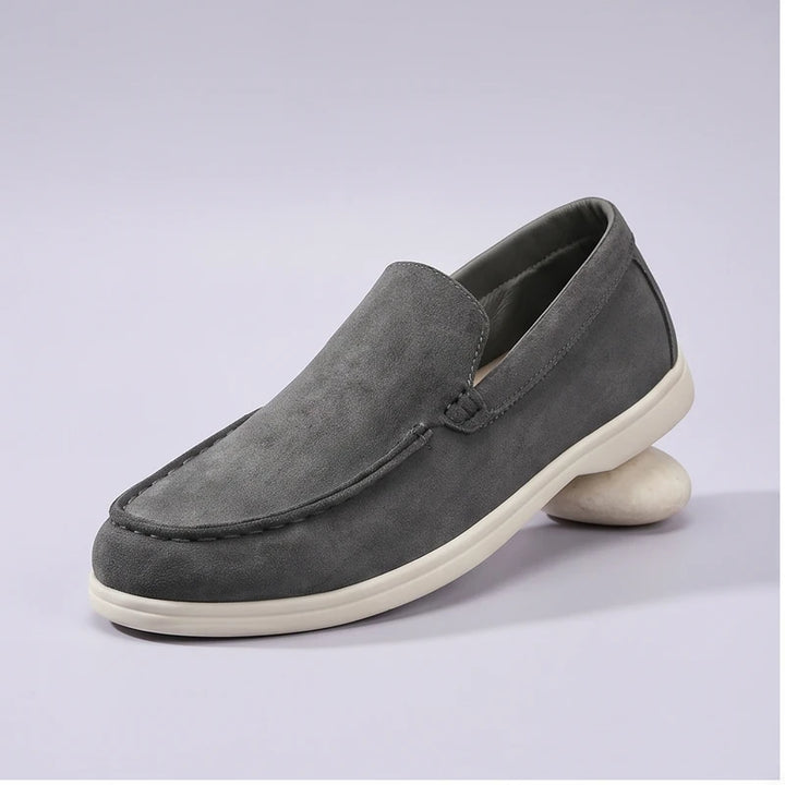 grey2 suede loafers in a studio background
